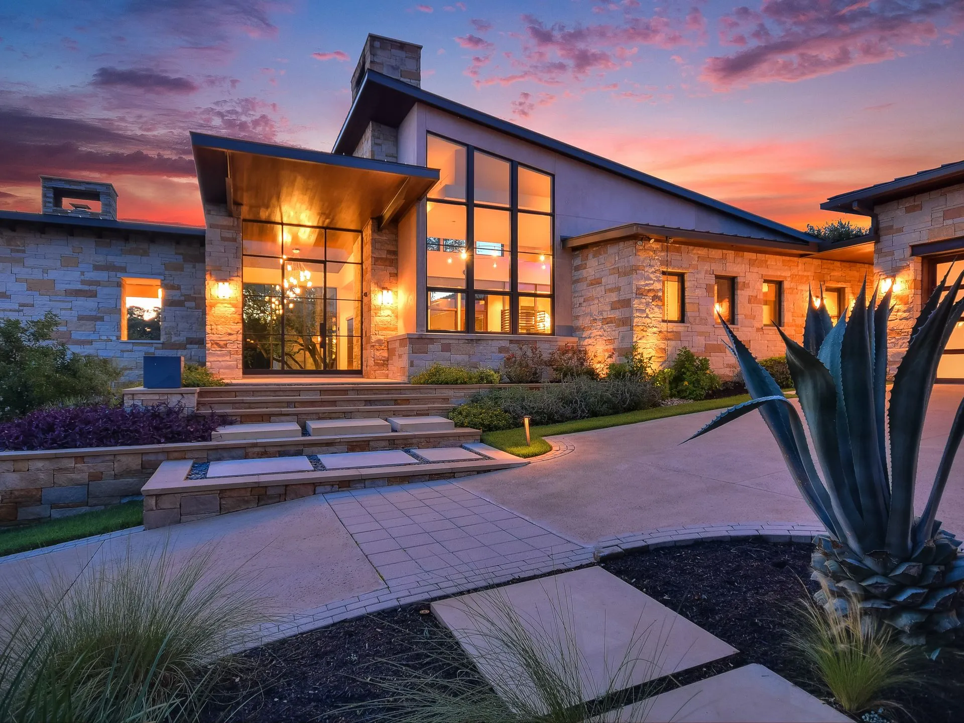 Exterior of a new beautiful modern home at sunset