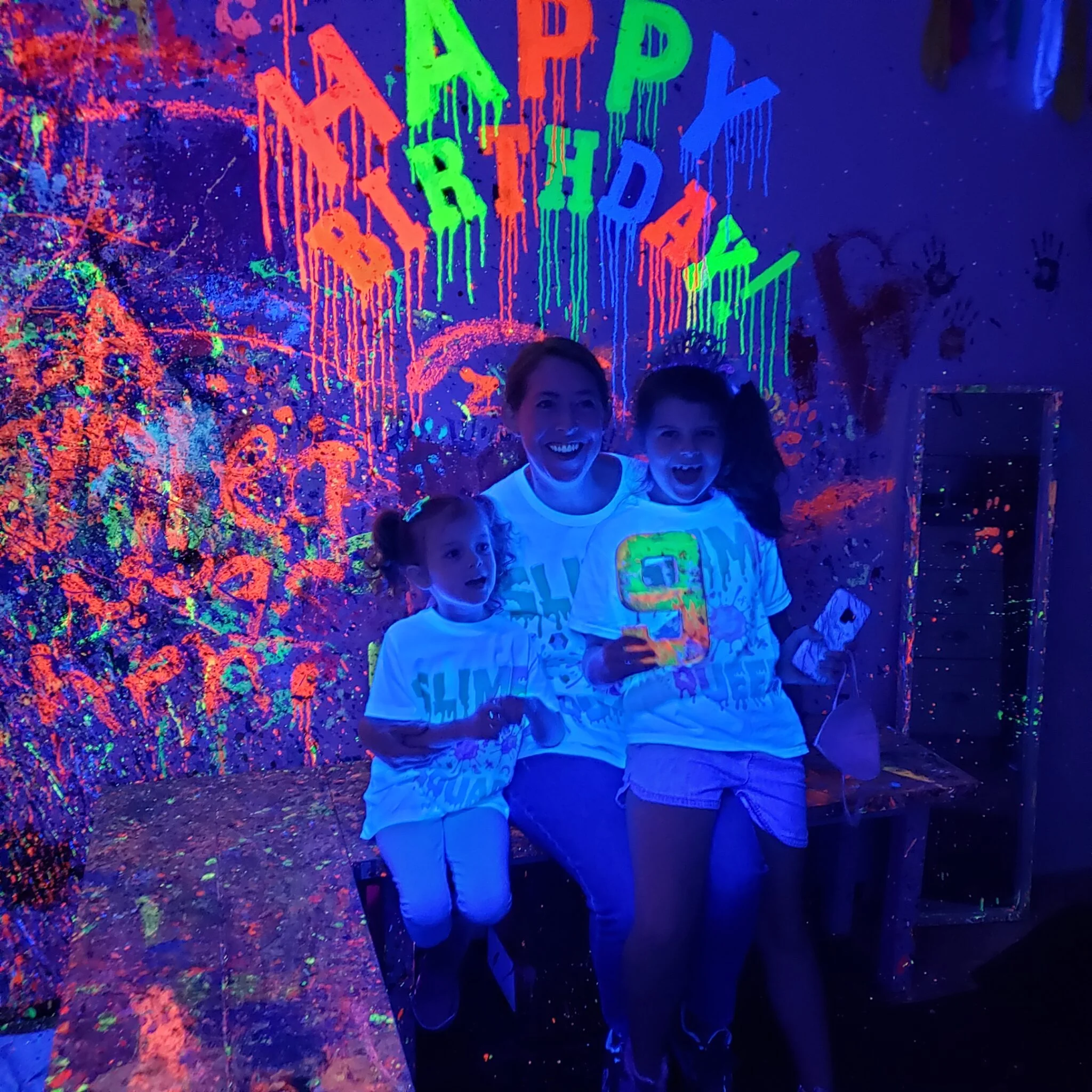 Family enjoying neon birthday party