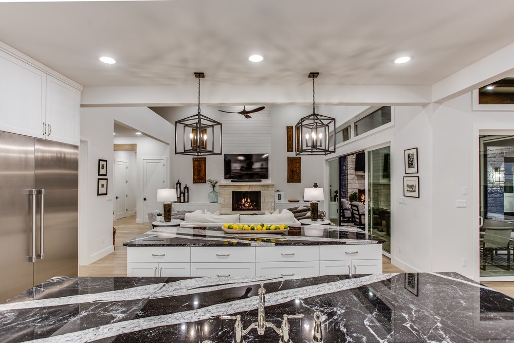 Freshly renovated kitchen with black marble counter top