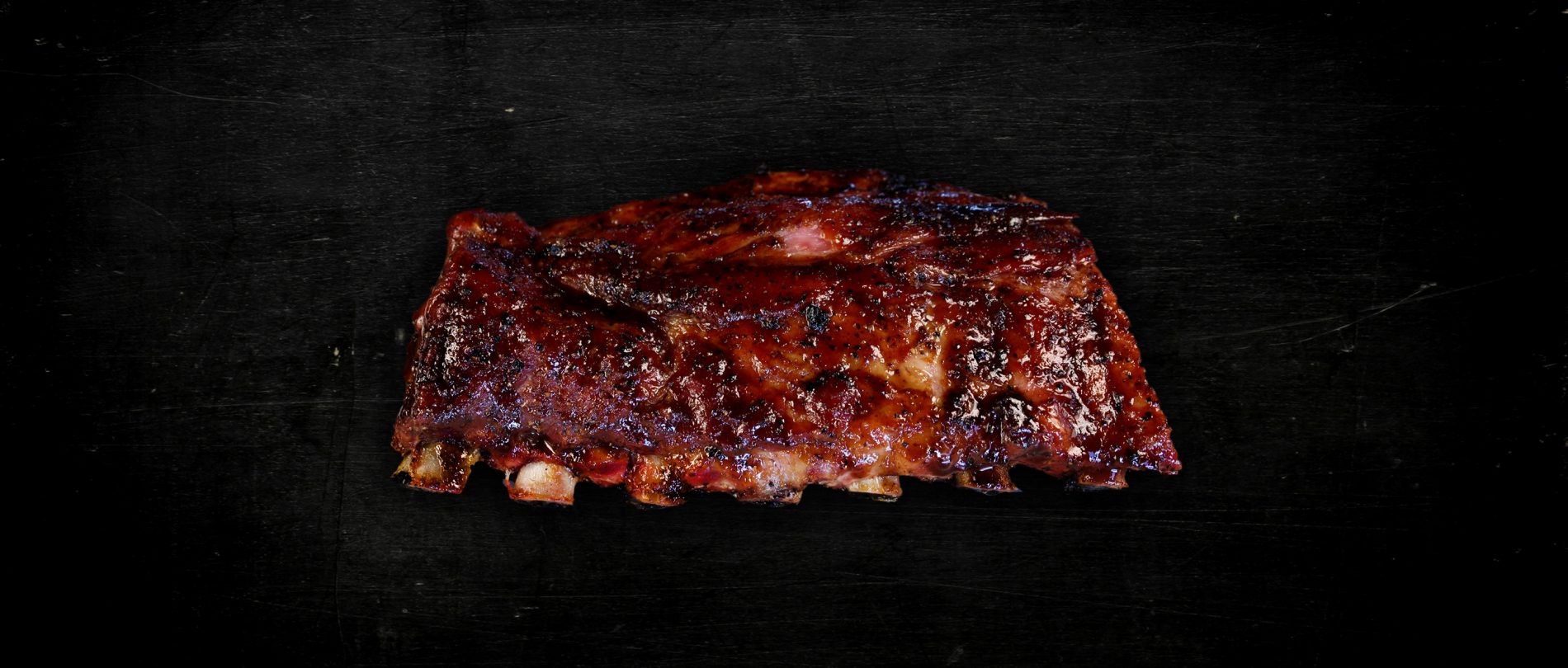 BBQ Ribs on black surface