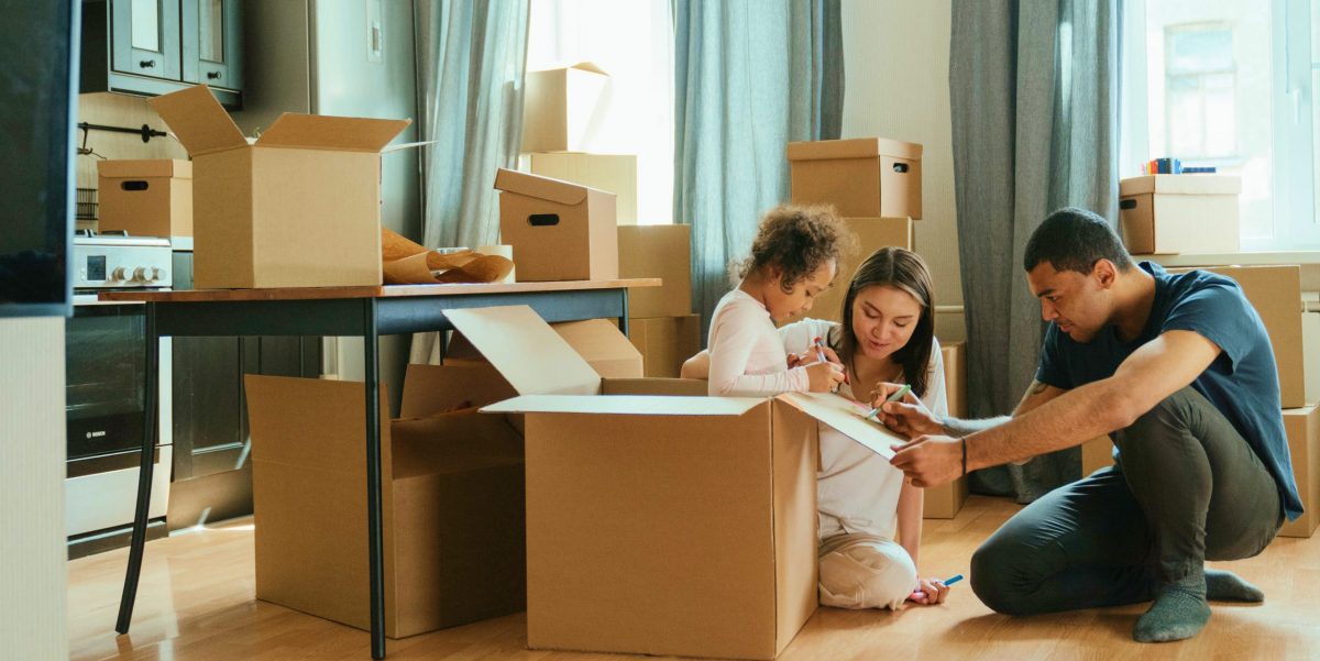 Family labeling moving boxes